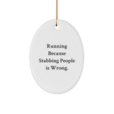 Funny Running Gifts for Men, Women, Friends, and Coworkers - Oval Ornament with Quote 'Running Because Stabbing People Is Wrong.' - Christmas Unique Gifts from Family - Image 1